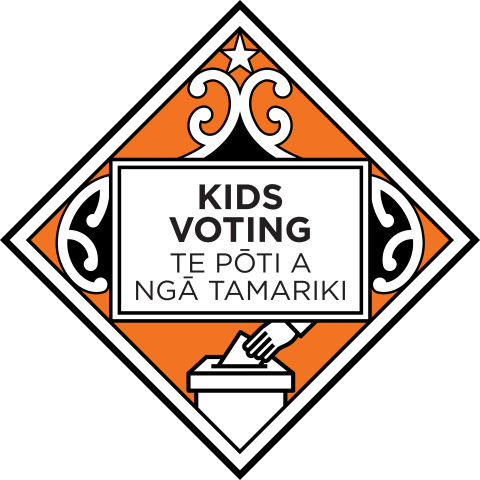 The Kids Voting logo - a diamond shape with koru patterns featuring an illustrated hand placing a vote into a ballot box. The words "Kids Voting - Te Pōti a Ngā Tamariki" are centred within the logo, inside a rectangular box.