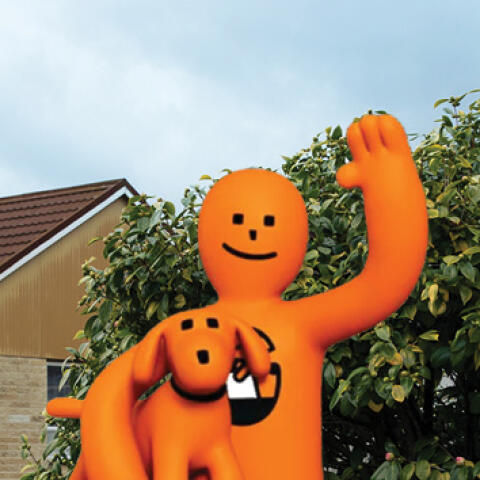 A simple illustration of Orange Guy waving
